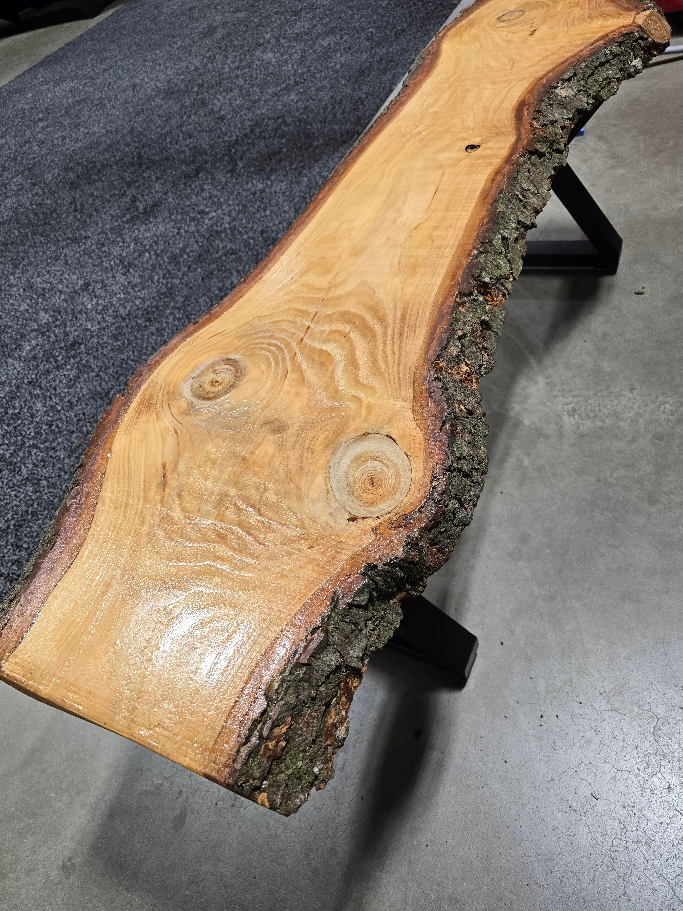 Live-edge wood slab with natural bark edge